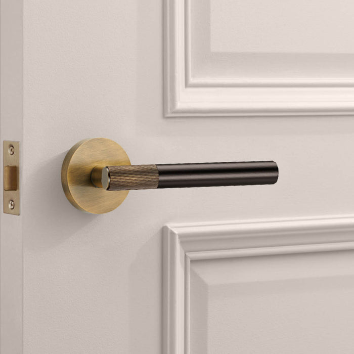 Antique Linear Lever Handle with Tip in Bronze – installed view