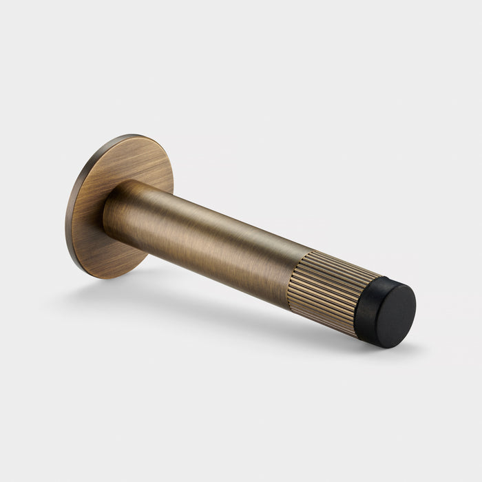 Antique Linear Wall Mounted Door Stop in Antique