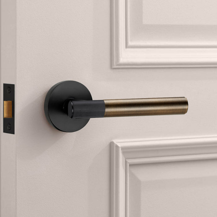 Black Linear Lever Handle with Tip in Antique – installed view