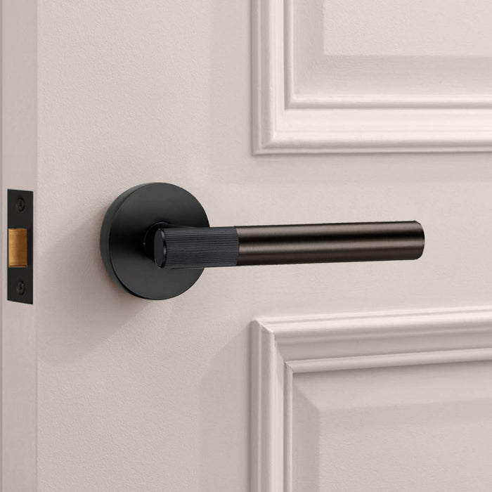 Black Linear Lever Handle with Tip in Bronze – installed view