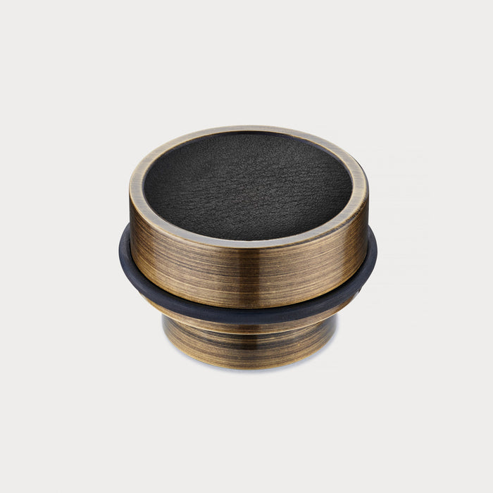 Brass & Black Leather Mounted Door Stops in Antique – installed view