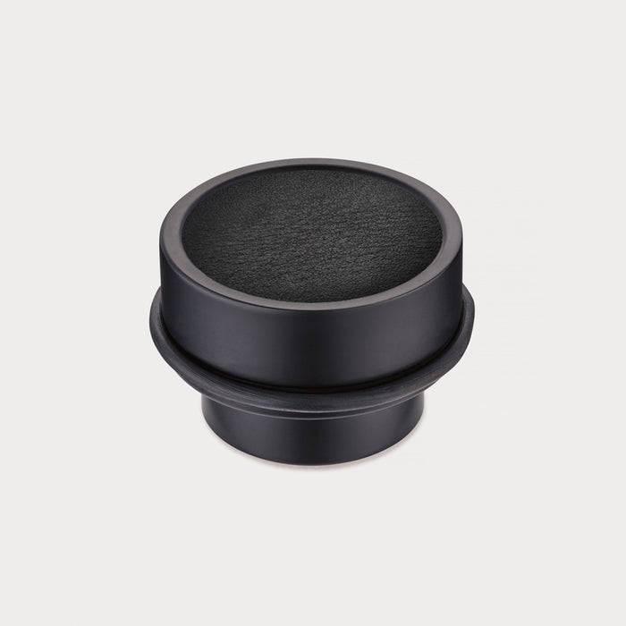 Brass & Black Leather Mounted Door Stops in Black – installed view