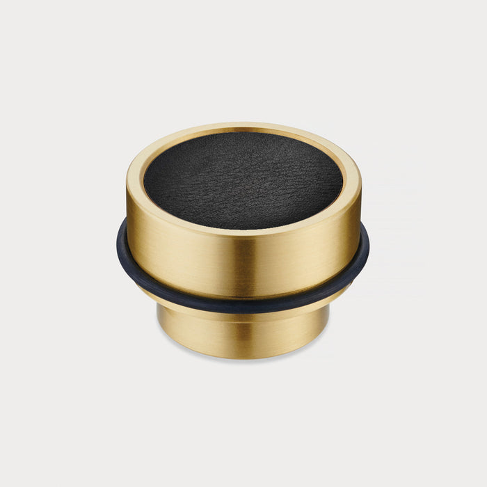 Brass & Black Leather Mounted Door Stops in Gold – installed view