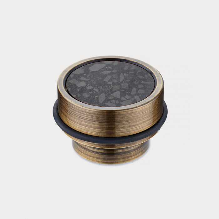 Brass & Black Terrazzo Floor Mounted Door Stops in Antique – installed view