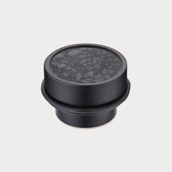 Brass & Black Terrazzo Floor Mounted Door Stops in Black – installed view