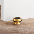 Brass & Black Terrazzo Floor Mounted Door Stops in Gold
