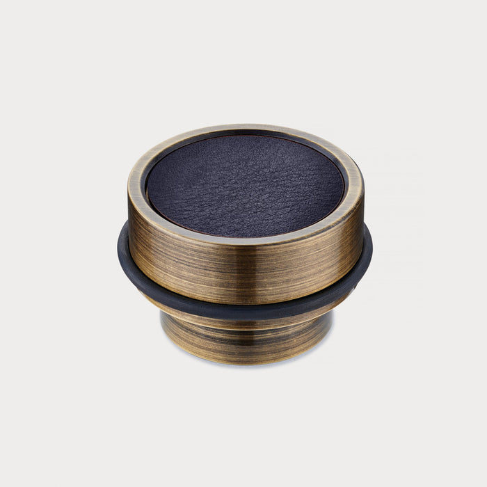Brass & Blue Leather Mounted Door Stops in Antique – installed view