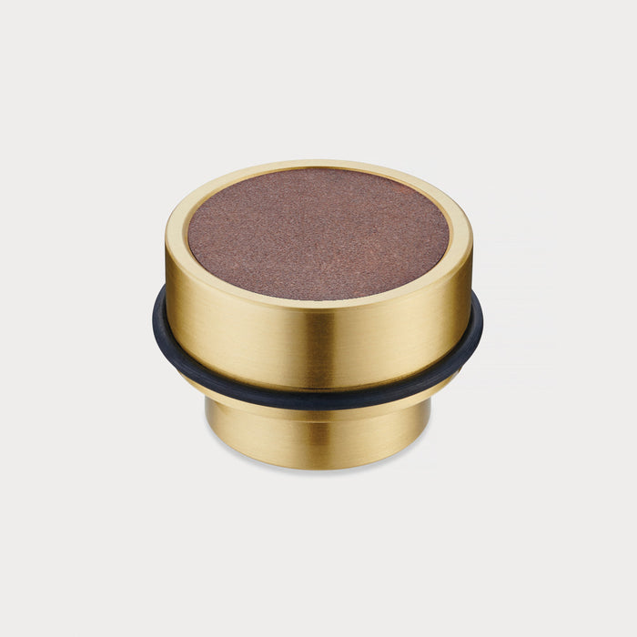 Brass & Brown Leather Mounted Door Stops in Gold – installed view