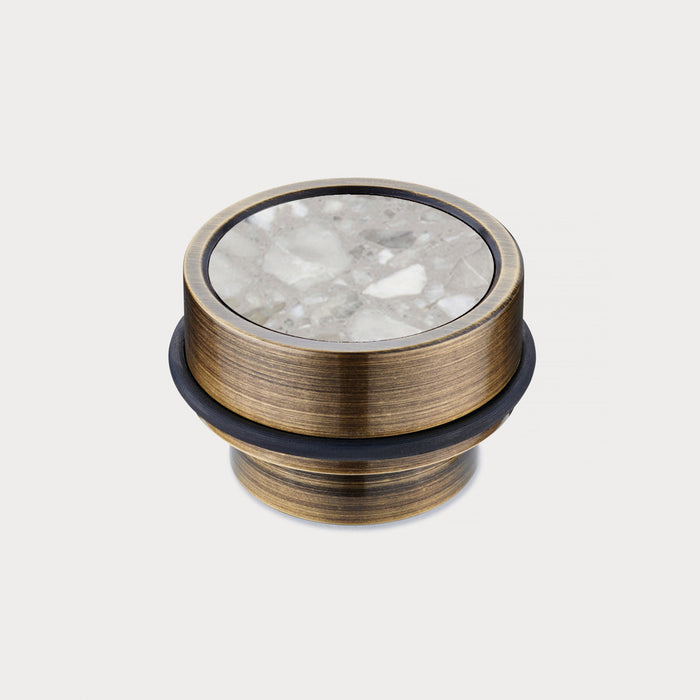 Brass & Grey Terrazzo Floor Mounted Door Stops in Antique – installed view