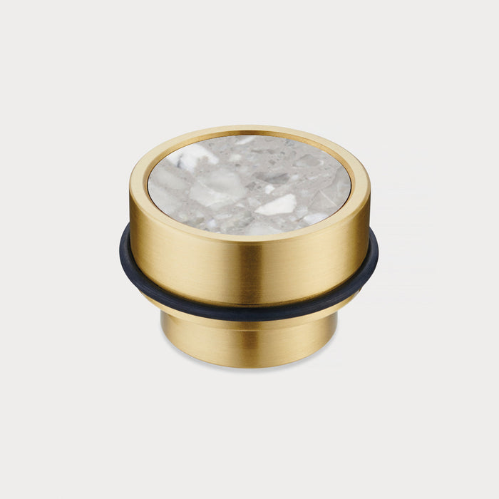 Brass & Grey Terrazzo Floor Mounted Door Stops in Gold – installed view