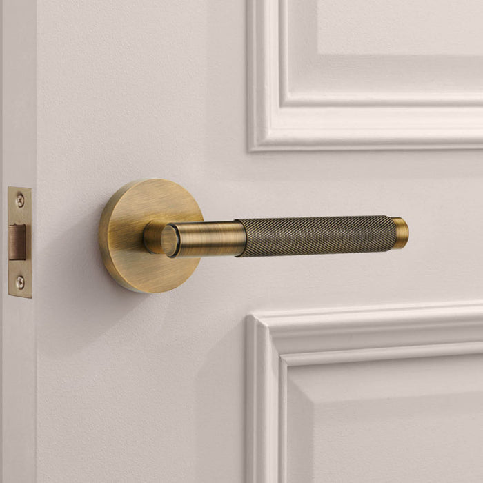 Brass Knurled Lever Door Handle in Antique – installed view