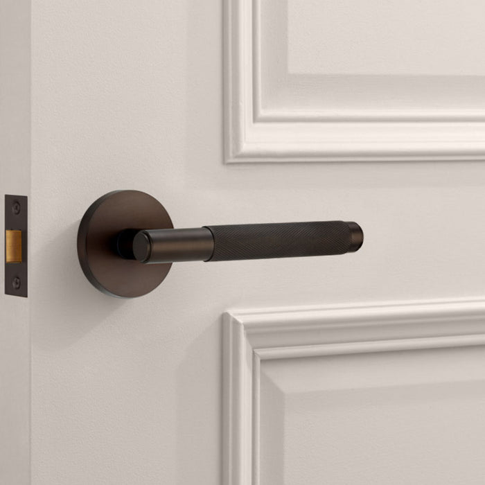 Brass Knurled Lever Door Handle in Bronze – installed view