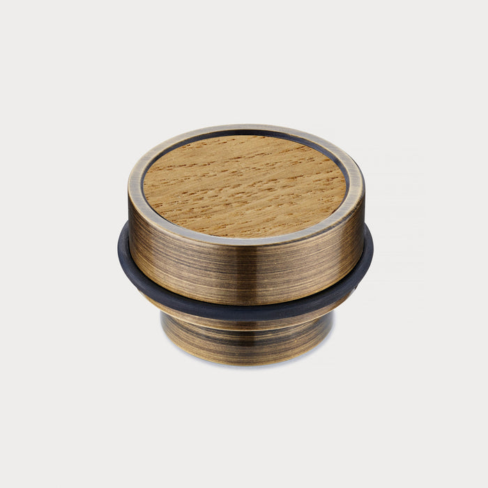 Brass & Oak Wood Floor Mounted Door Stops in Antique – installed view