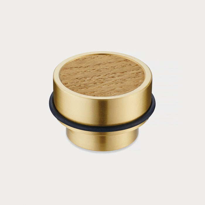 Brass & Oak Wood Floor Mounted Door Stops in Gold – installed view