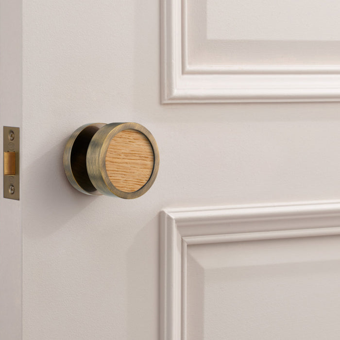 Brass and walnut mortice door knobs