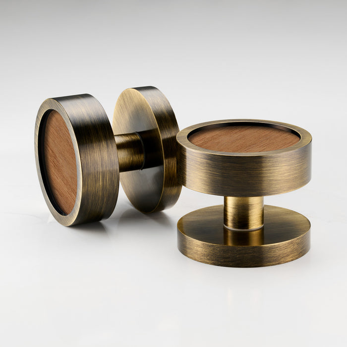Brass and walnut mortice door knobs