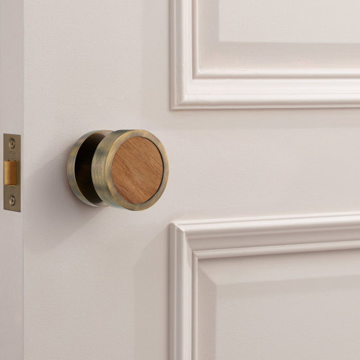 Brass and walnut mortice door knobs