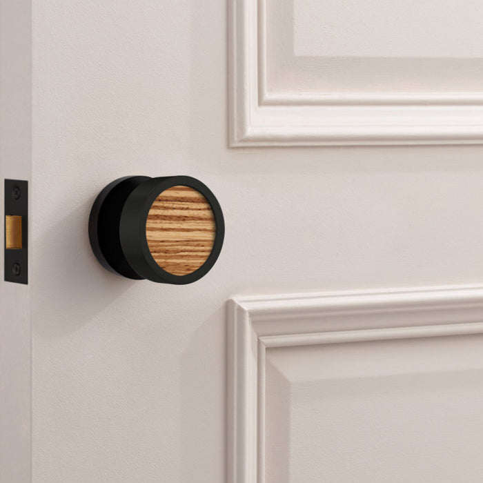 Brass & Wood Mortice Door Knobs in Black – installed view