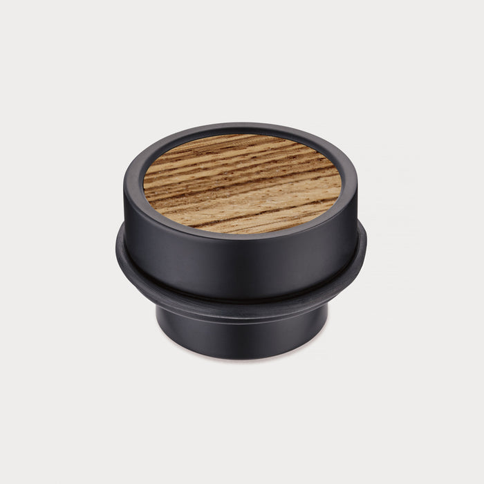 Brass & Zebrano Wood Floor Mounted Door Stops in Black – installed view