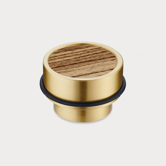 Brass & Zebrano Wood Floor Mounted Door Stops in Gold – installed view