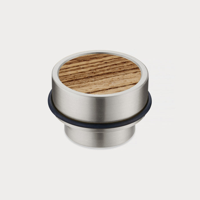 Brass & Zebrano Wood Floor Mounted Door Stops in Silver – installed view