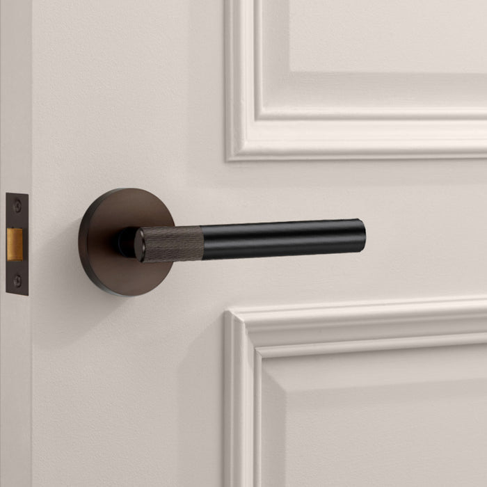 Bronze Linear Lever Handle with Tip in Black – installed view