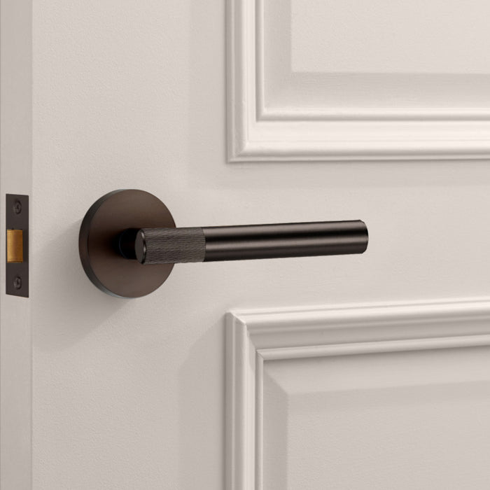 Bronze Linear Lever Handle with Tip in Bronze – installed view