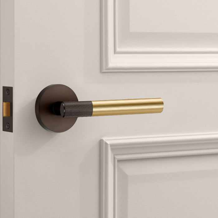 Bronze Linear Lever Handle with Tip in Gold – installed view
