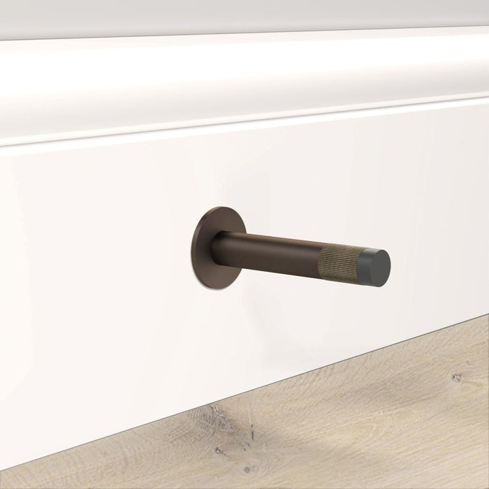 Bronze Linear Wall Mounted Door Stop in Antique Gold – installed view