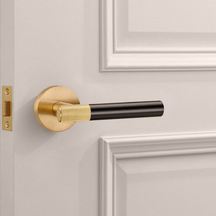 Gold Linear Lever Handle with Tip in Bronze – installed view