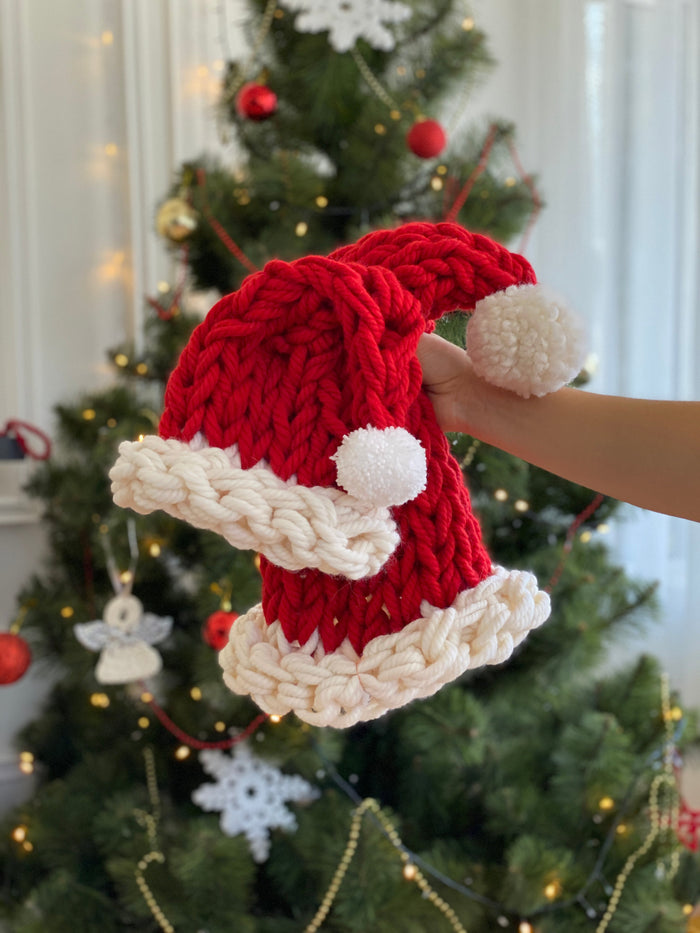 Knitted Santa hats for family Christmas photos.
