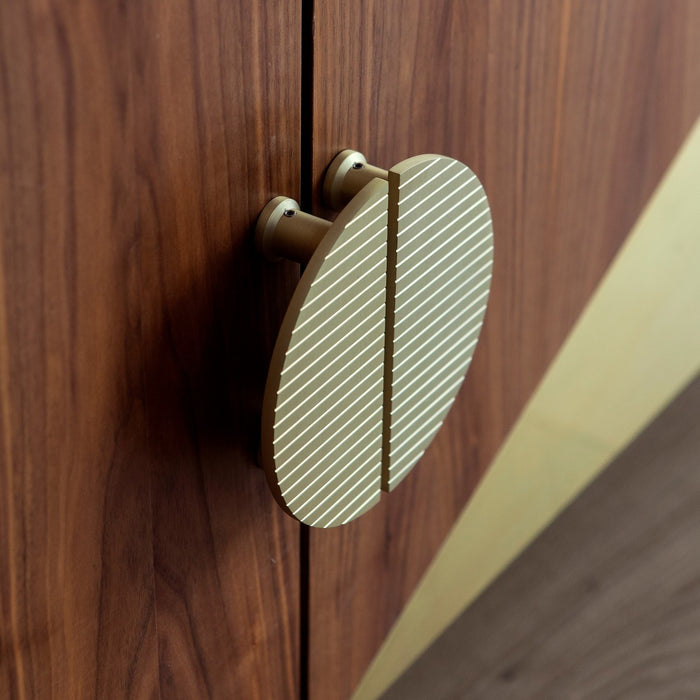 Large Solid Brass Striped Half Moon Handles in Gold – installed view