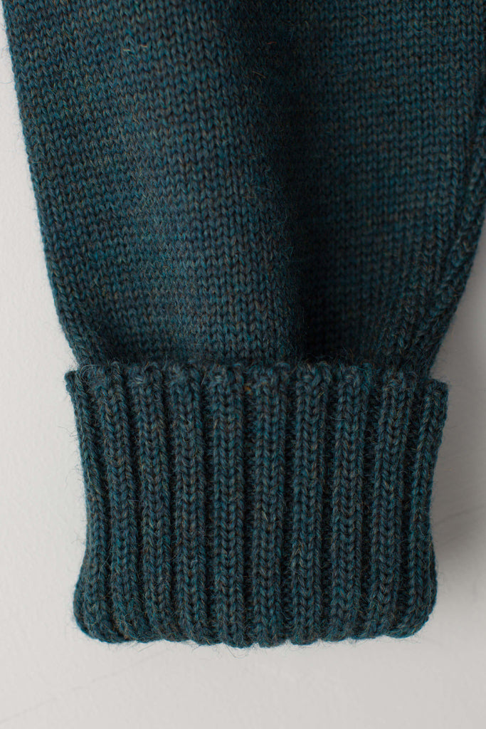 Folded cuff detail on a Mallard Green Traditional Guernsey