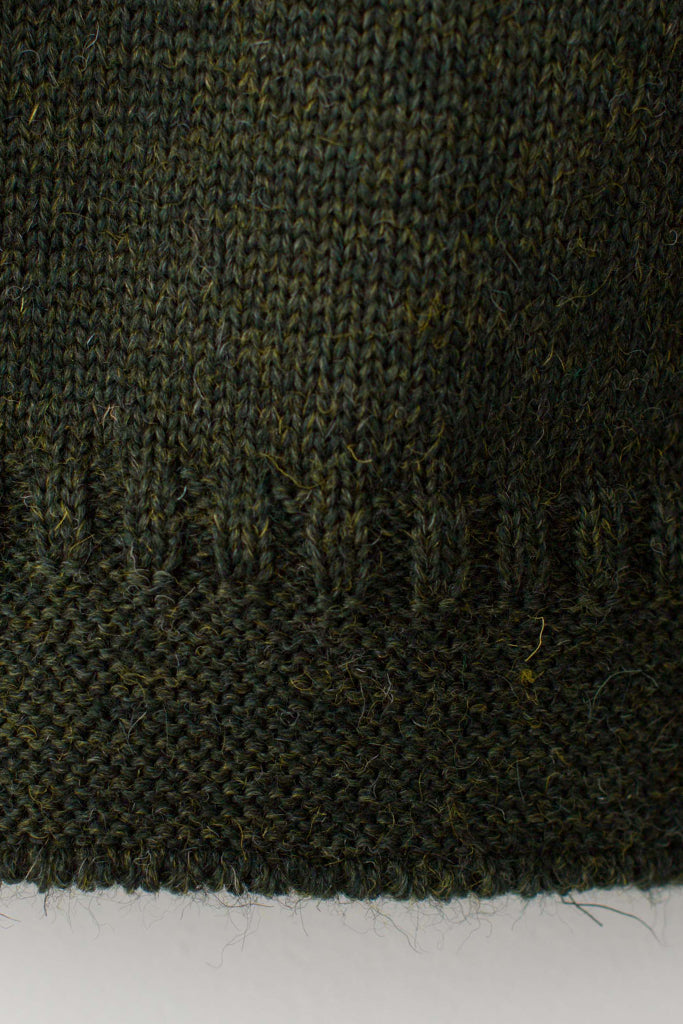 Hem detail on a Military Green Zipped Guernsey Jacket