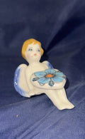 Phoenix Blue Daisy Sitting Angel with Blonde Hair holding heart - Pattern: Blue Daisy
