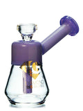 A small bubbler with a 14mm removable bowl piece in clear and purple colors by Diamond Glass.