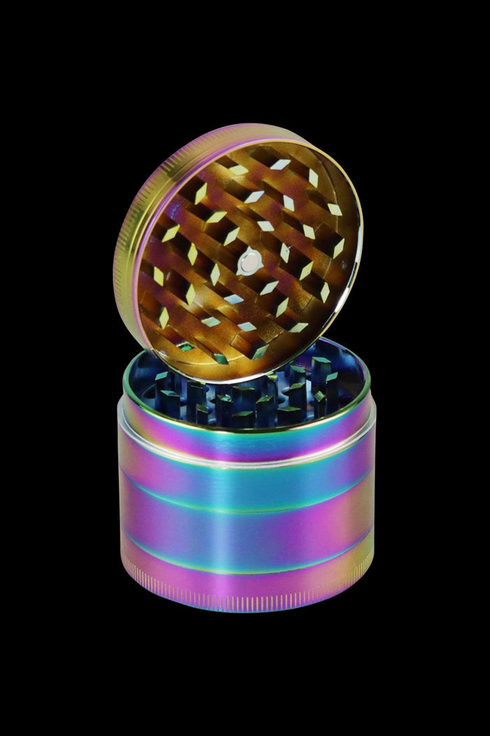 A top-down view of the open Anodized Zinc 4-Piece Grinder - Chameleon, displaying its multi-tiered, metallic grinding mechanism.