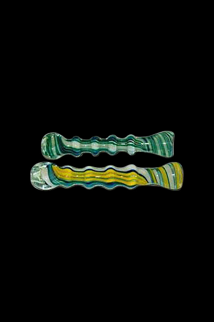 A close-up shows the Ribbed Twisted Stripe Pattern Glass Taster, displaying its ribbed texture and twisted stripe design against a black background.