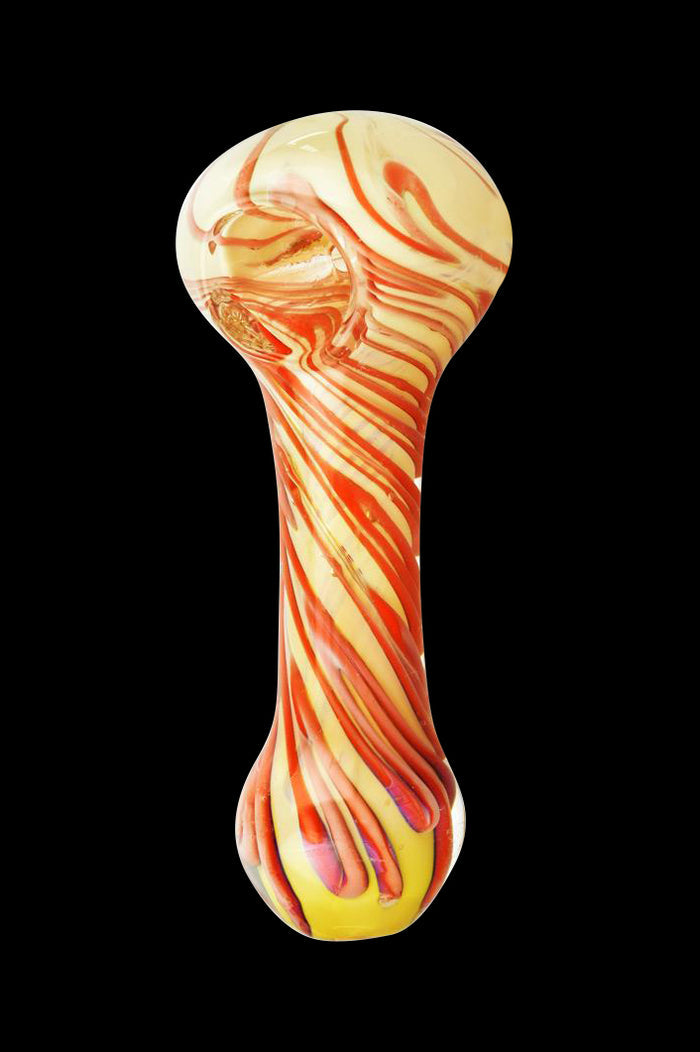 Centered front view of the Worked Swirl Spoon Pipe - Gilbert showing yellow glass with red swirled ribbons against a black background