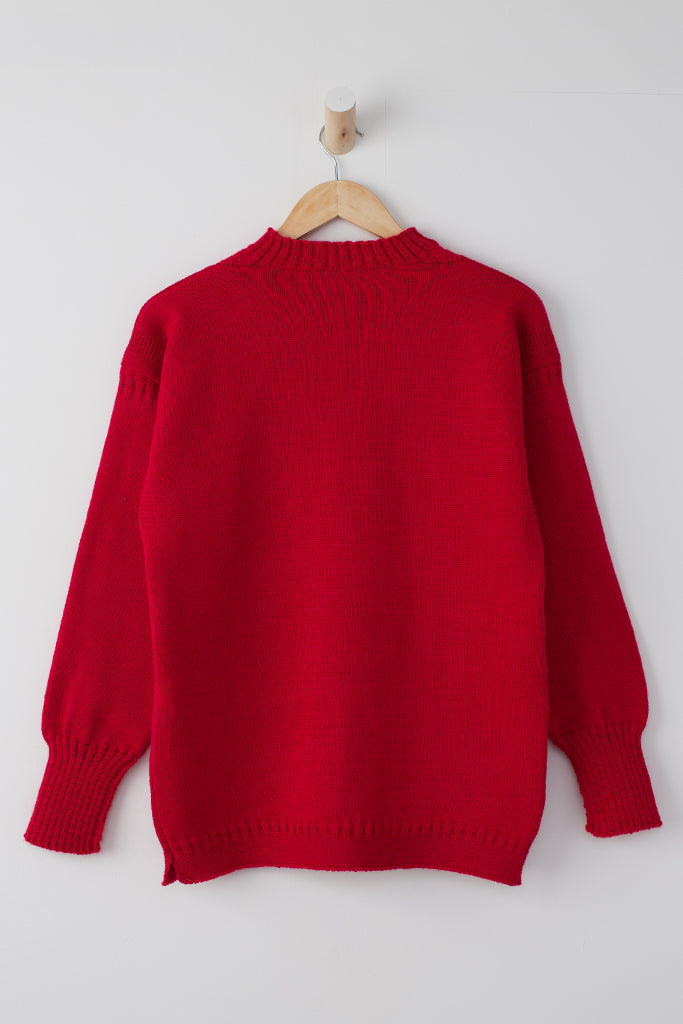 Tartan Red Traditional Guernsey Jumper on a wooden hanger