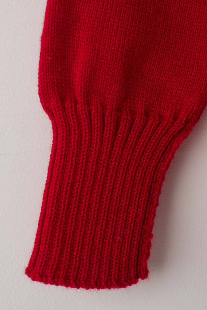 Open cuff detail on a Tartan Red Traditional Guernsey