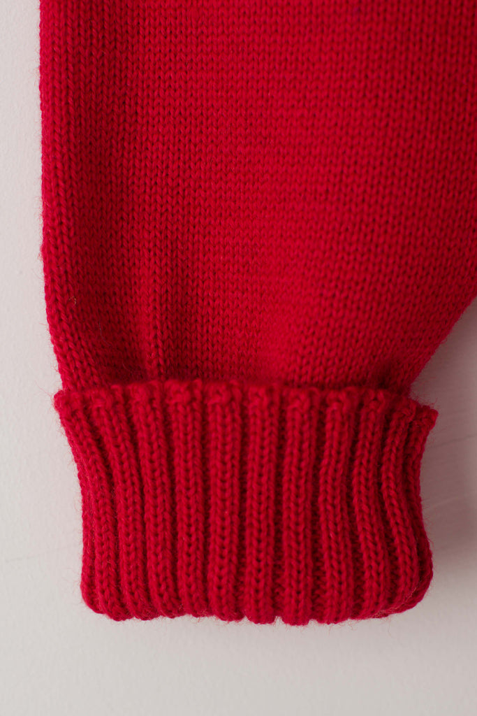 Folded cuff detail on a Tartan Red Traditional Guernsey
