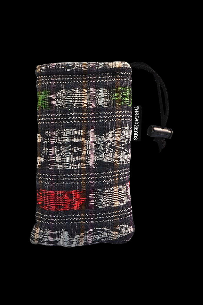 The ThreadHeads Drawstring Padded Pouch is shown in a close-up, angled view, featuring a dark patterned fabric and a black drawstring.