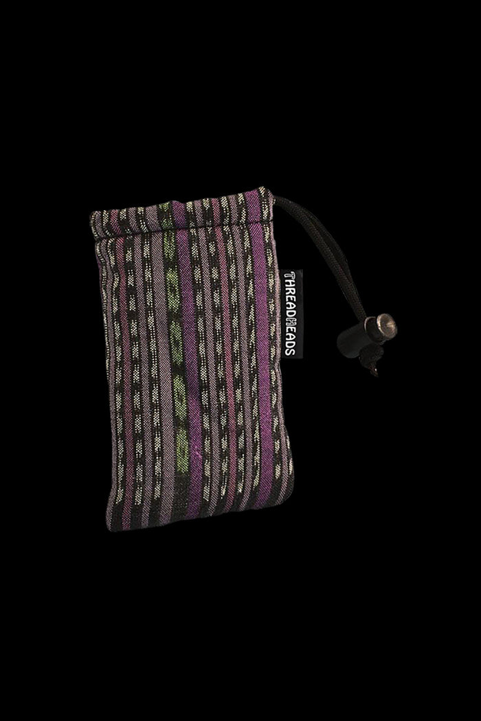 A close-up of the ThreadHeads Drawstring Padded Pouch, showing its textured surface and drawstring closure against a dark backdrop.